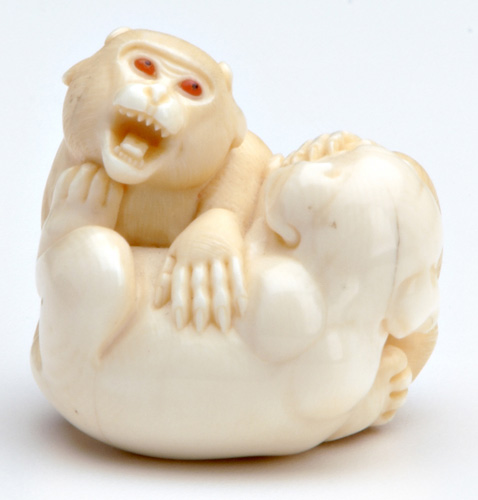 Appraisal: JAPANESE NETSUKE Ivory nestuke by Kenji of two frolicking pups