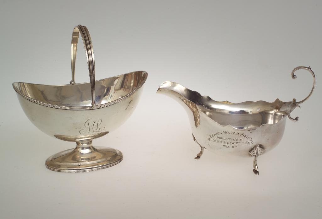 Appraisal: EDWARDIAN SILVER SUGAR BASKET CHESTER of navette form with swing