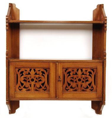 Appraisal: A Victorian mahogany hanging shelf with a pair of pierced