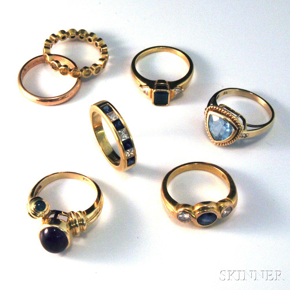 Appraisal: Seven Gold Rings an kt gold sapphire and diamond band