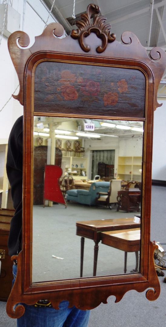 Appraisal: An th century style fret cut mahogany wall mirror with