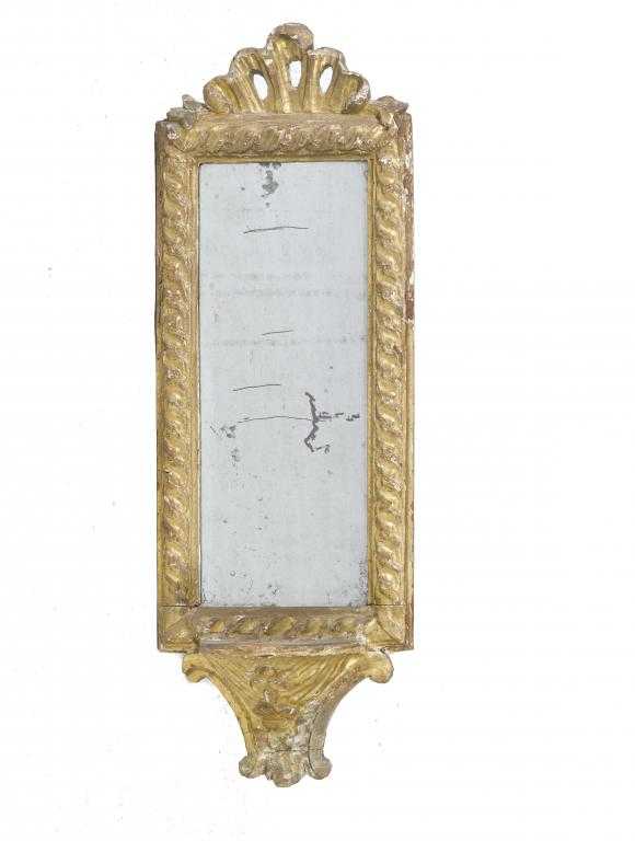 Appraisal: A CONTINENTAL GILTWOOD MIRROR with bracket shelf and shell crest