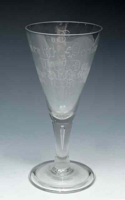 Appraisal: A LARGE COMMEMORATIVE GOBLET the trumpet bowl engraved 'Peace was