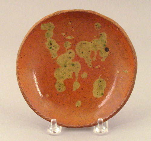 Appraisal: Connecticut redware toddy plate th c with yellow and green