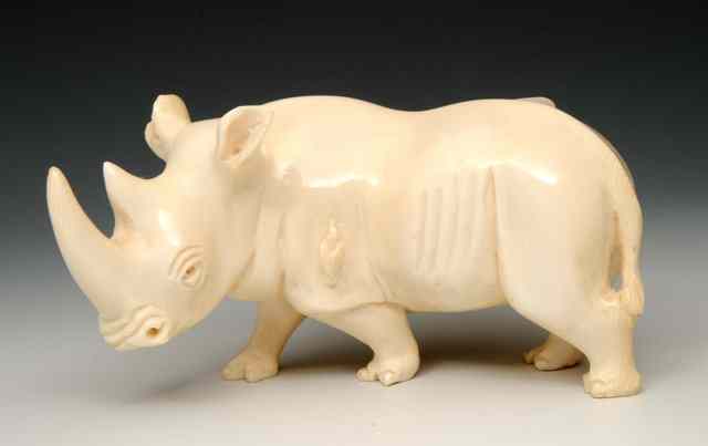 Appraisal: A SIMILAR INDIAN CARVED MODEL of a rhinoceros