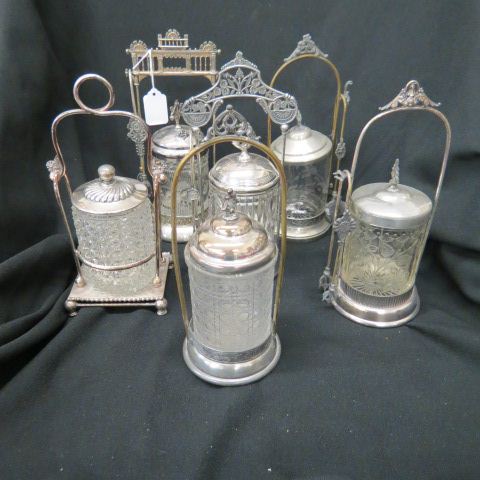 Appraisal: Victorian Pickle Castors various pattern glass inserts in silverplate holders