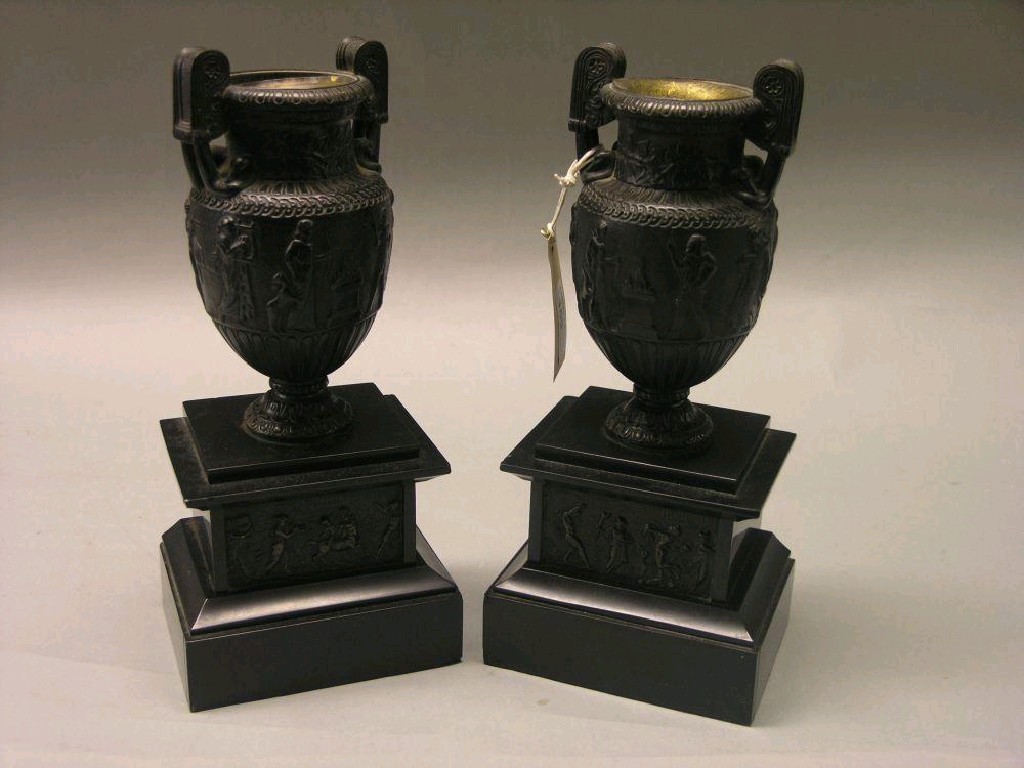 Appraisal: A pair of Victorian bronze vases cast in ancient Egyptian