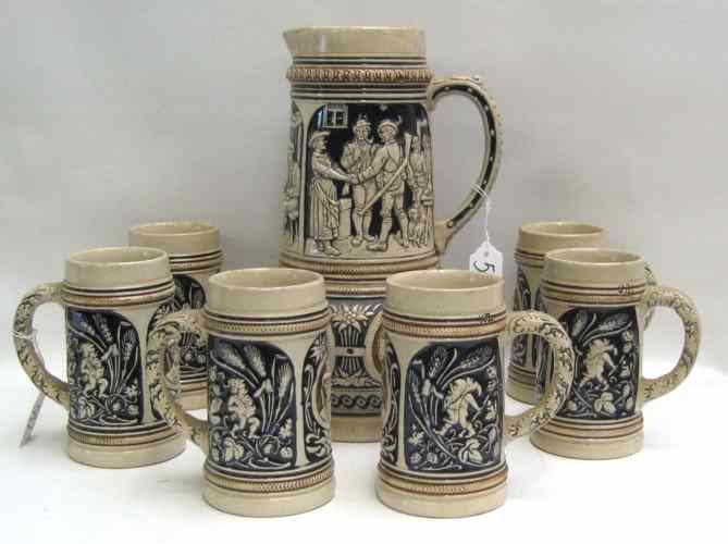 Appraisal: SEVEN PIECE GERMAN POTTERY TANKARD STEIN SET the tankard ''H