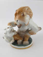 Appraisal: A Russian ceramic humorous group of a lion and a