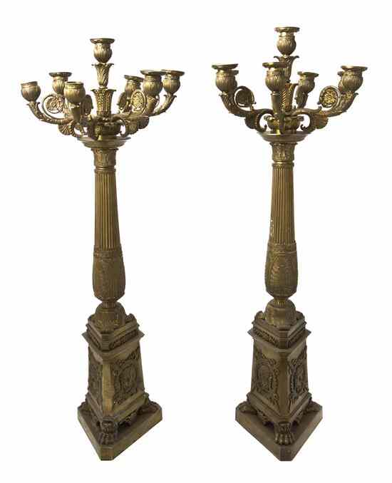 Appraisal: A Pair of Empire Style Bronze Seven-Light Candelabra each of