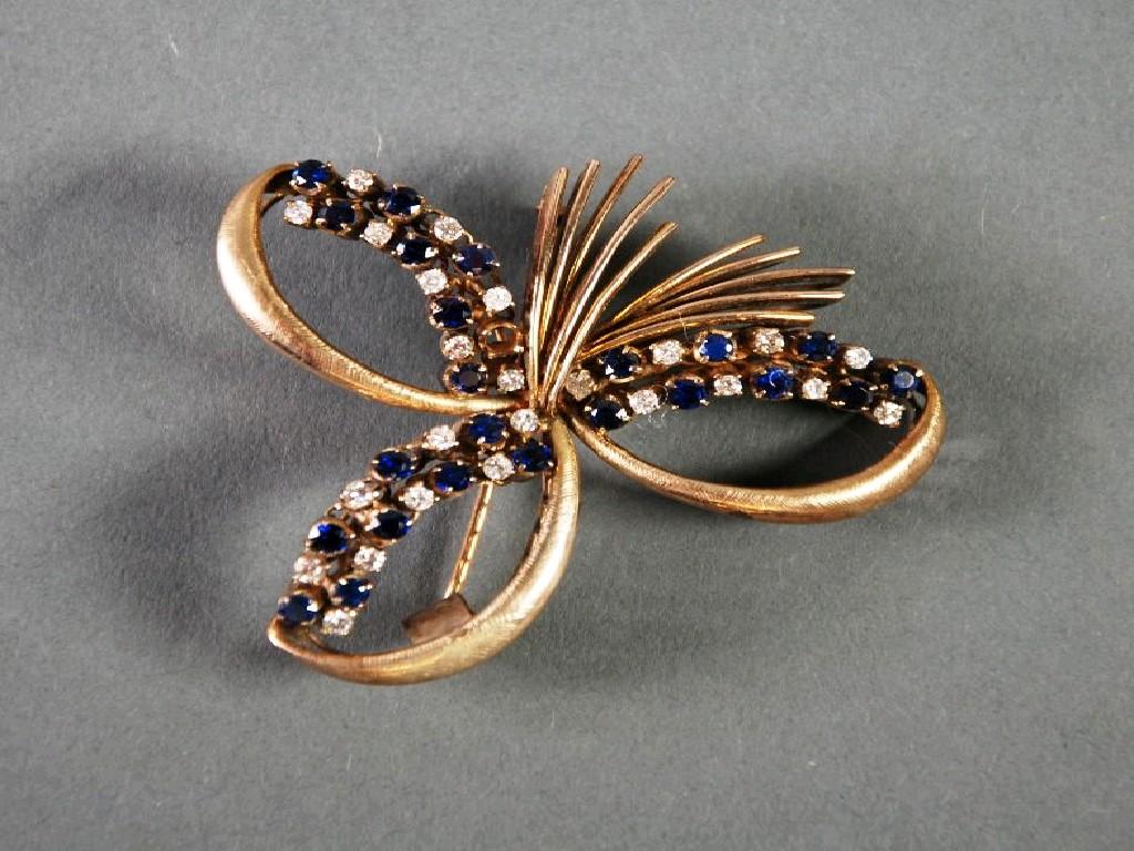 Appraisal: ct GOLD TREFOIL SCROLL BROOCH set with diamonds and sapphires