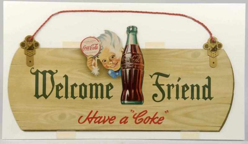 Appraisal: Cardboard Coca-Cola Cutout Sign Description Features the original braided hanging