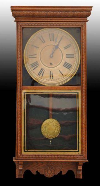 Appraisal: Oak Regulator Wall Clock Description Working Includes pendulum Condition Excellent