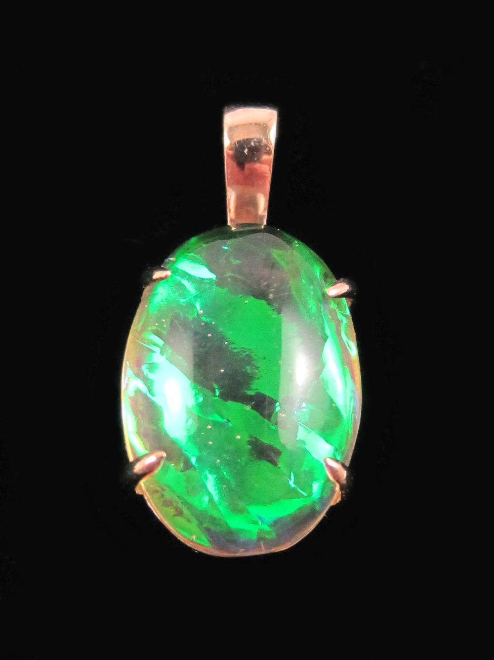 Appraisal: OPAL TRIPLET AND FOURTEEN KARAT ROSE GOLD PENDANT with four