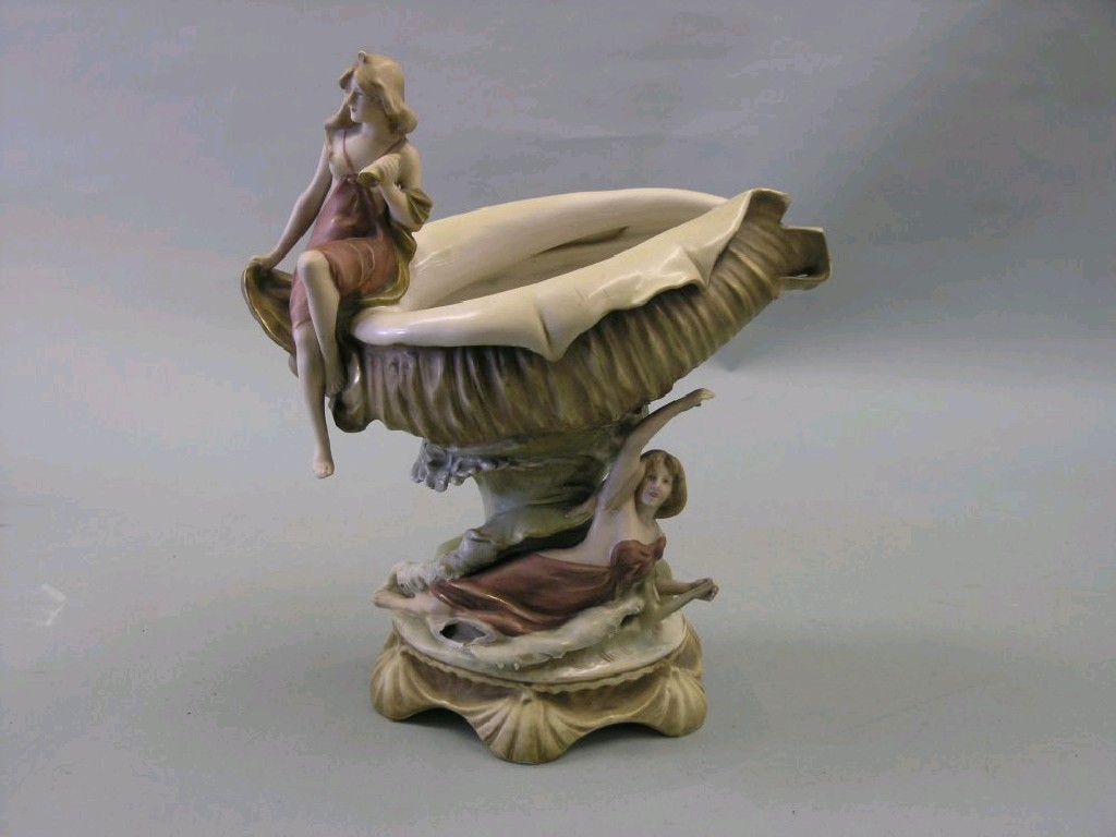 Appraisal: An Art Nouveau Royal Dux centrepiece young maiden seated upon