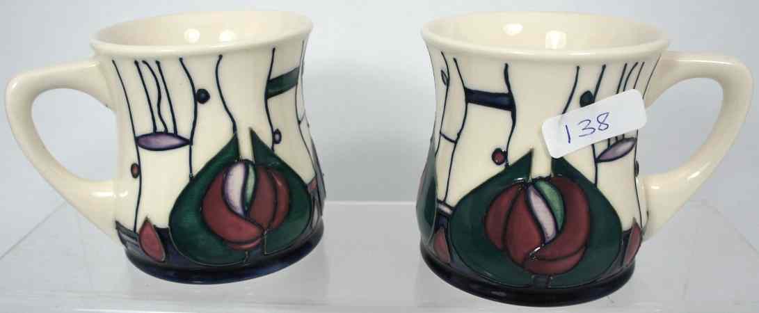 Appraisal: Pair Moorcroft Mugs decorated in the Macintosh design boxed