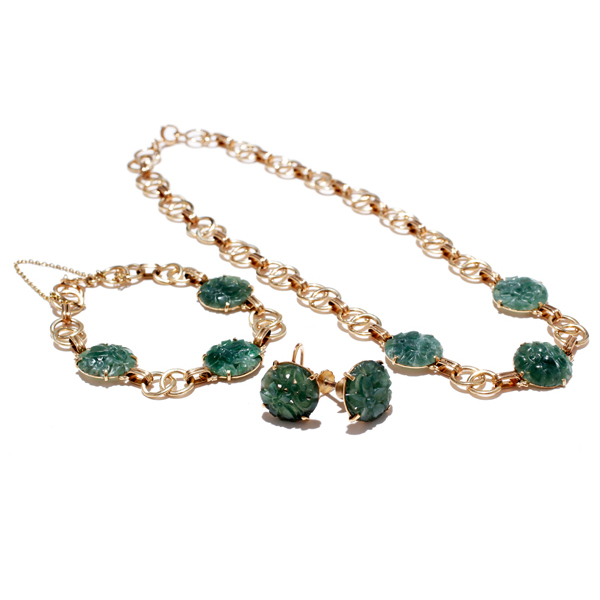 Appraisal: Gold K estate jewelry set featuring Chinese carved jade floral