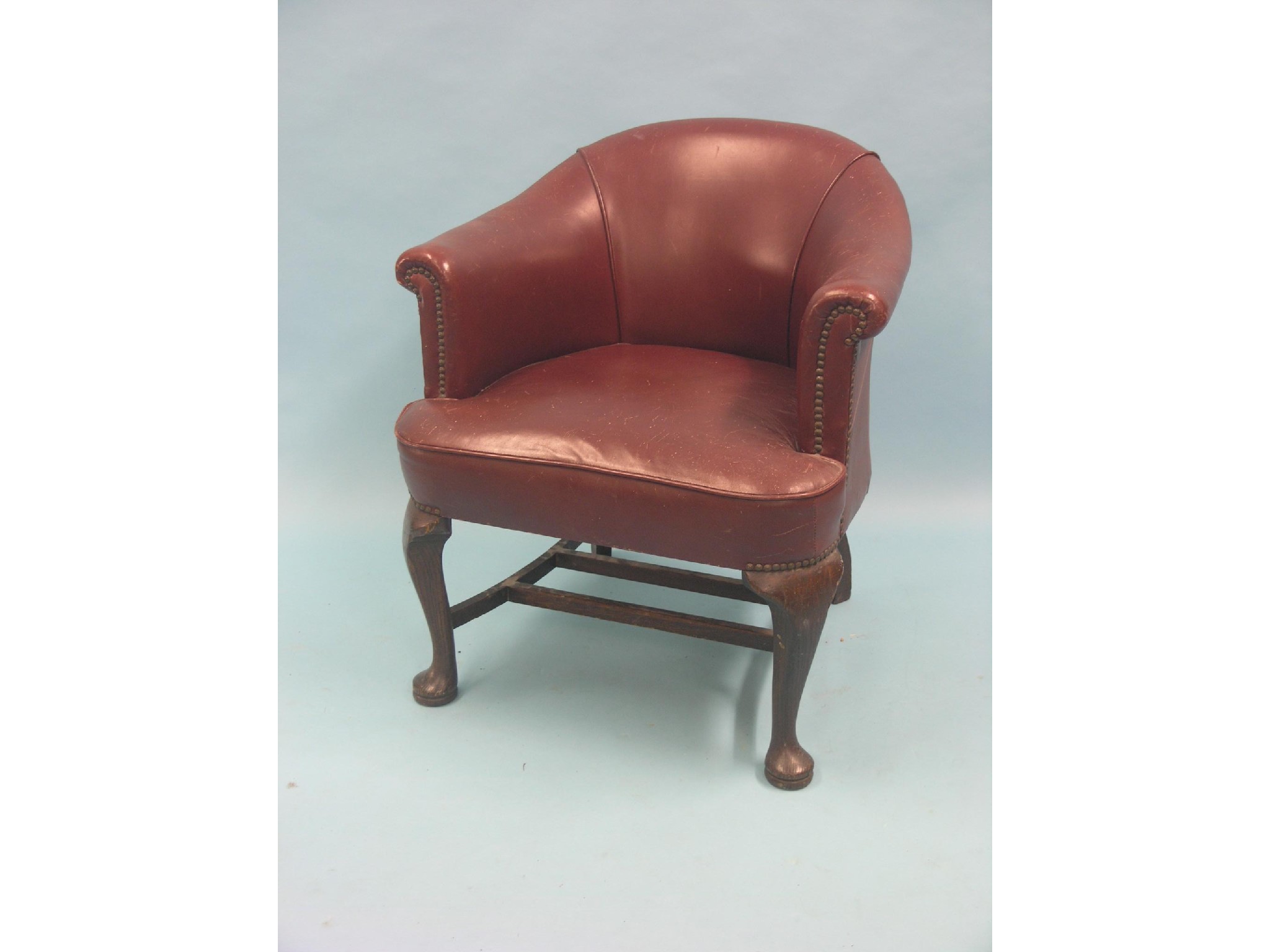 Appraisal: An early th century office armchair upholstered in a red