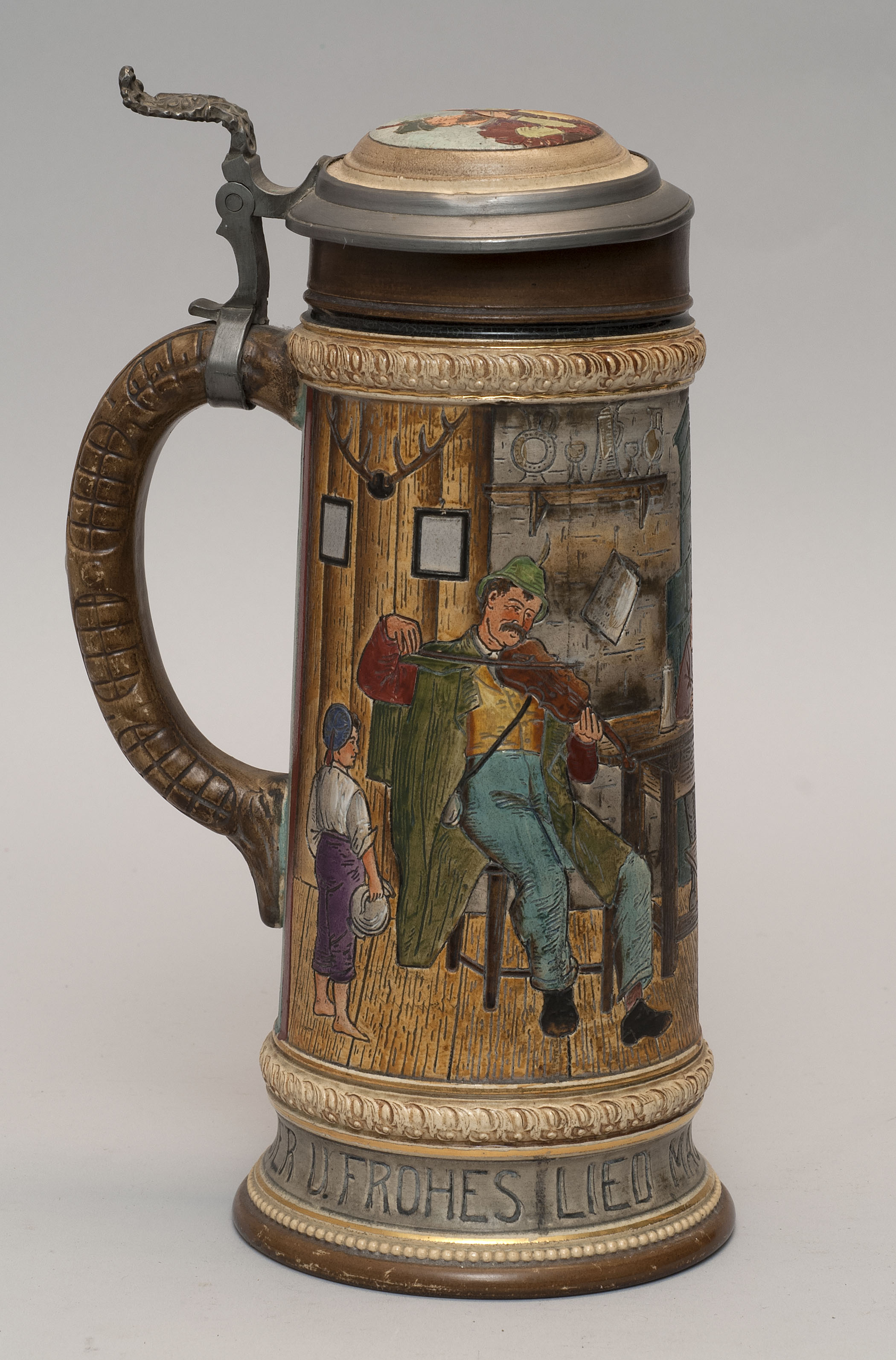 Appraisal: GERMAN POTTERY LIDDED STEIN Circa With decoration of figures in