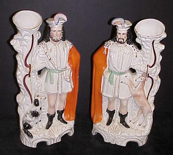 Appraisal: Pair of Victorian Staffordshire spill vases depicting a hunter with