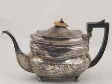 Appraisal: A barge shaped silver teapot with decorated banding by Alexander