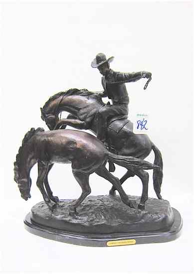 Appraisal: BRONZE FIGURAL SCULPTURE ''Cowboy Catching a Horse '' mounted on