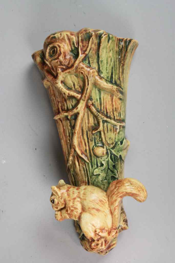 Appraisal: WELLER POTTERY WOODCRAFT WALL POCKET WITH SQUIRREL long flattened trumpet