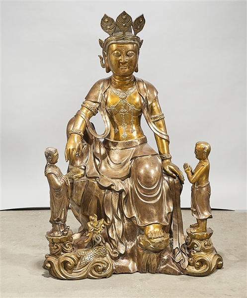 Appraisal: Chinese metal seated Guanyin with attendants x x approx Condition