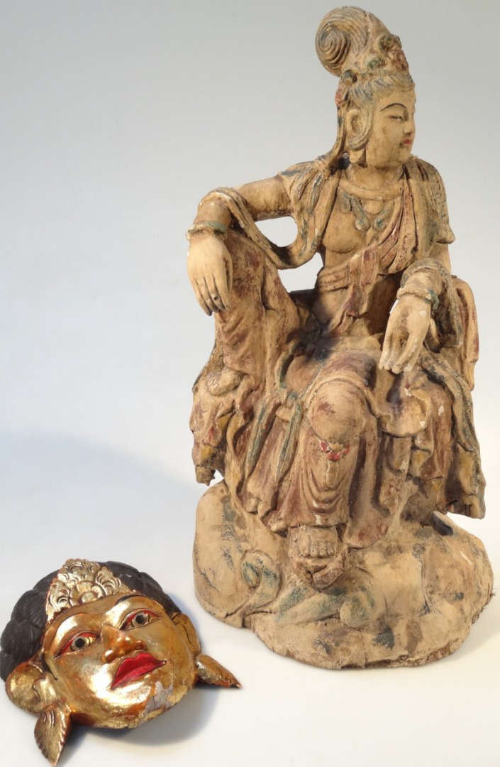 Appraisal: An Eastern carved wooden figure of a seated goddess signed