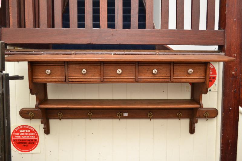 Appraisal: A FRENCH OAK WALL MOUNTED COAT RACK WITH FIVE DRAWERS