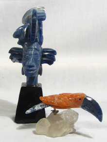 Appraisal: A carving in coloured natural stones of a toucan on