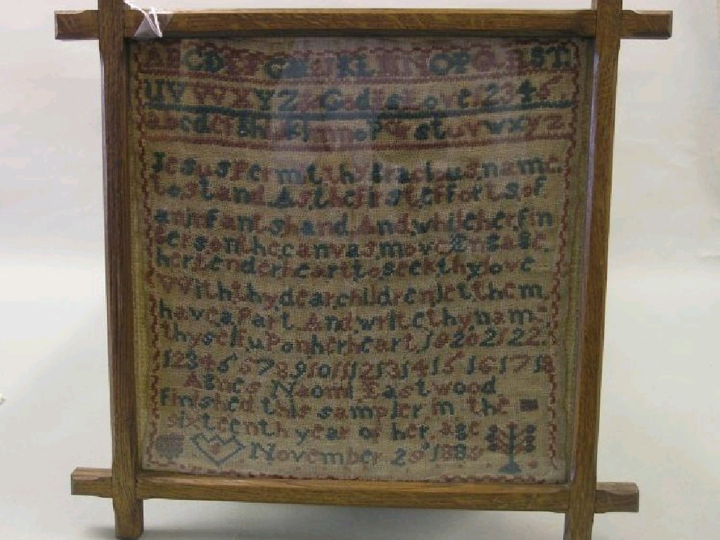 Appraisal: A needlework sampler worked with alphabet and religious verse in