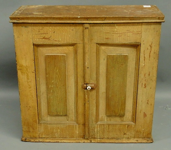 Appraisal: Grain painted cabinet th c with raised panel doors h