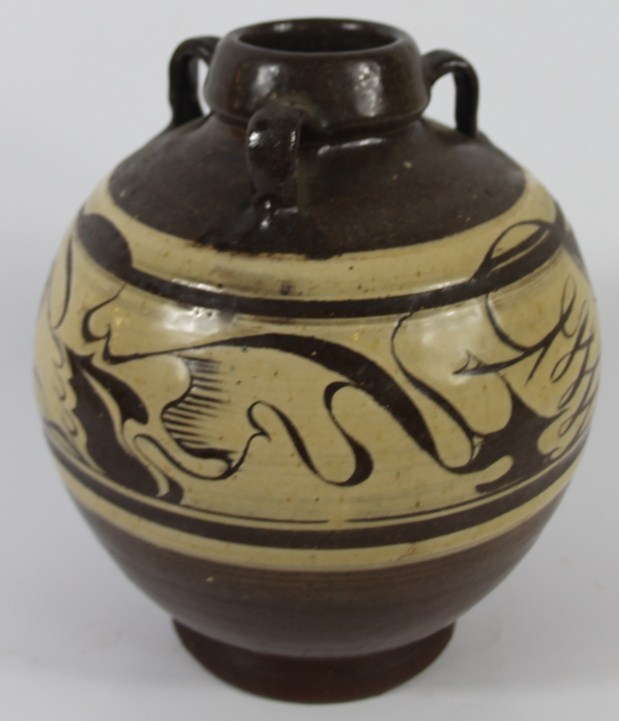 Appraisal: A brown glazed studio pottery vase with a band of