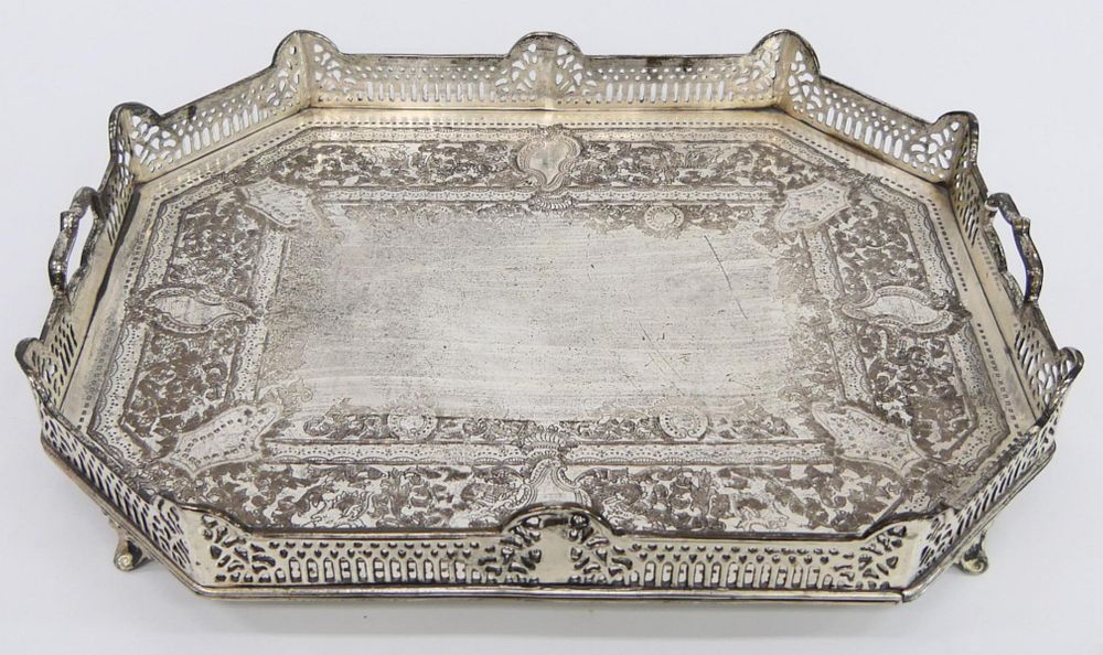 Appraisal: CHASED SILVERPLATE HANDLED FOOTED SERVING PLATTER A chased silver plated