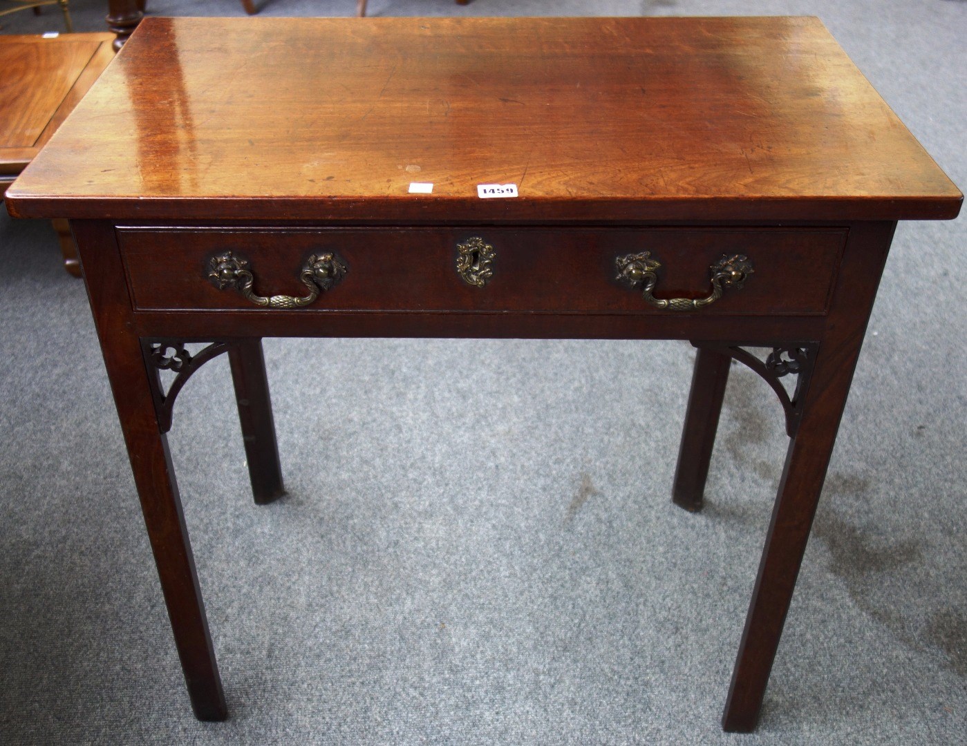 Appraisal: A mid- th century mahogany single drawer side table on