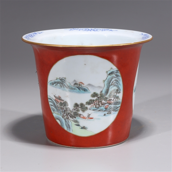 Appraisal: Chinese red ground porcelain planter with gilt detail and landscapes