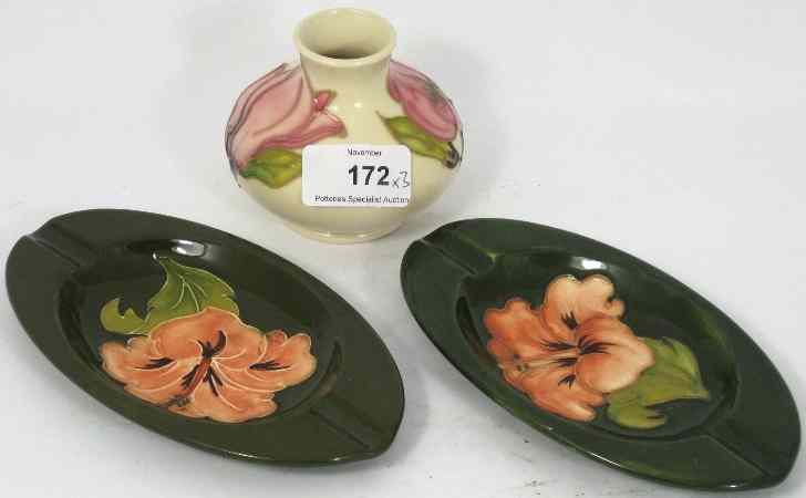 Appraisal: Two Moorcroft Hibiscus on Green Ground Ashtrays And Small Vase