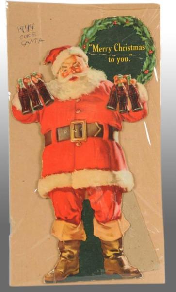 Appraisal: Cardboard Coca-Cola Die-Cut Santa Claus Easel-Back Description Strong bend on