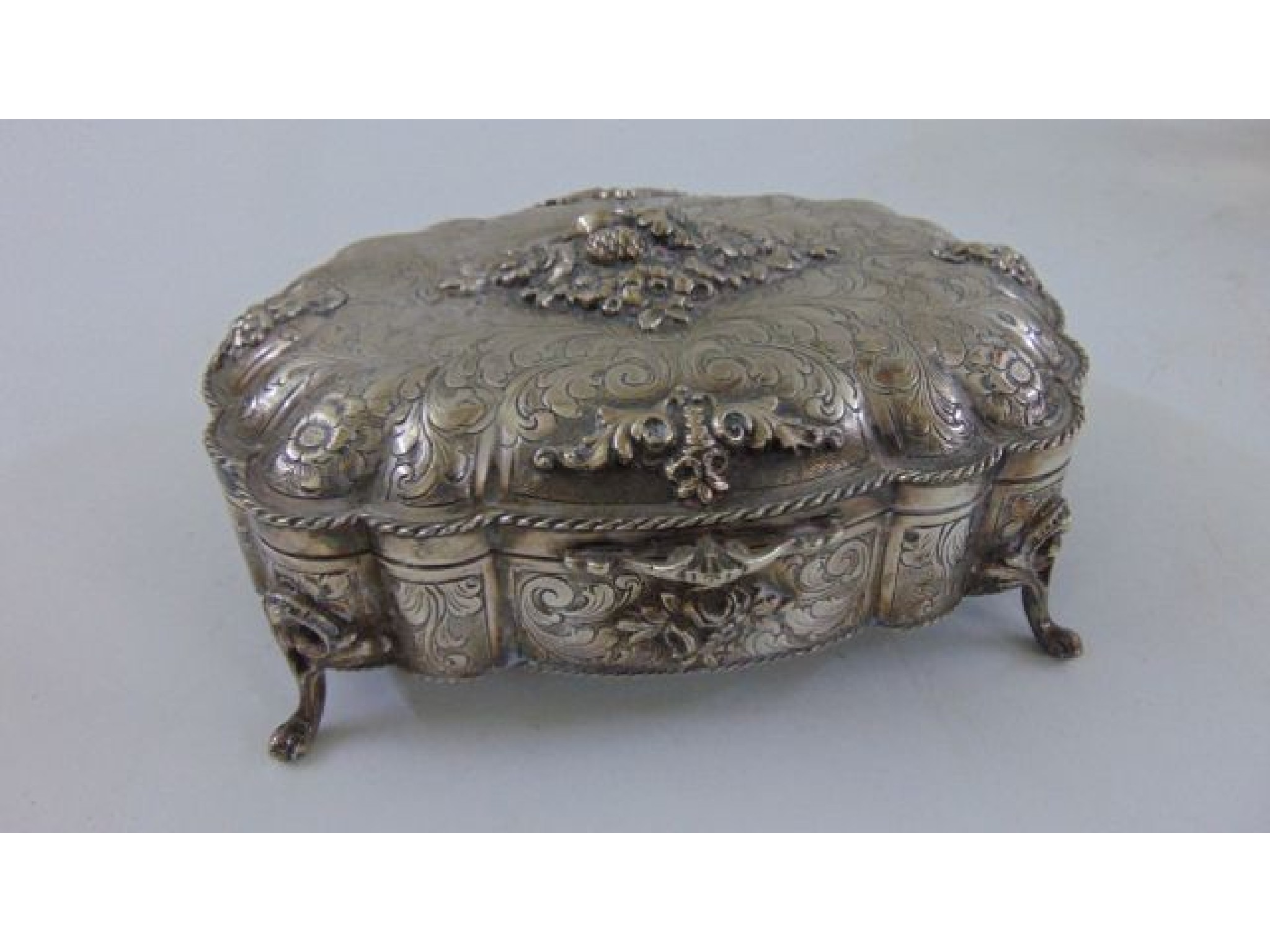 Appraisal: A Scandinavian silver trinket box with engraved and embossed detail