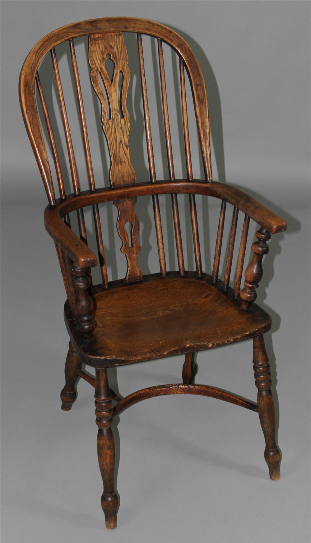 Appraisal: ENGLISH ELMWOOD WINDSOR ARM CHAIR with hooped spindle back centered