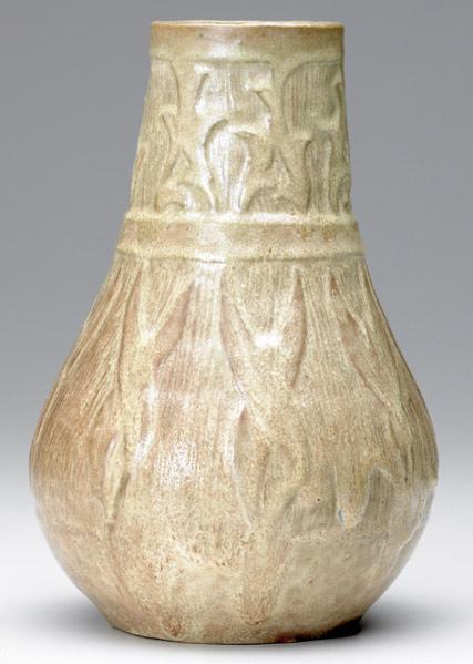 Appraisal: AREQUIPA Large bulbous vase carved with leaves and covered in