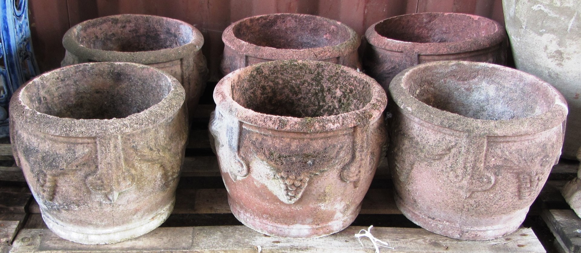 Appraisal: A set of six reconstituted stone circular planters relief moulded