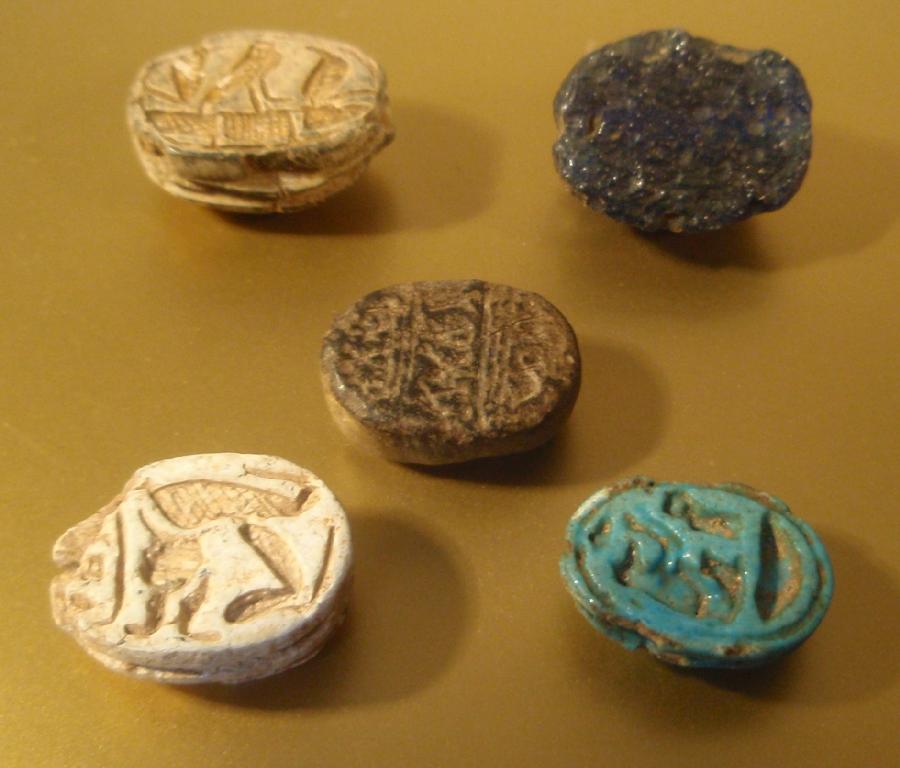 Appraisal: Five Egyptian scarabs including two steatite one with a turquoise