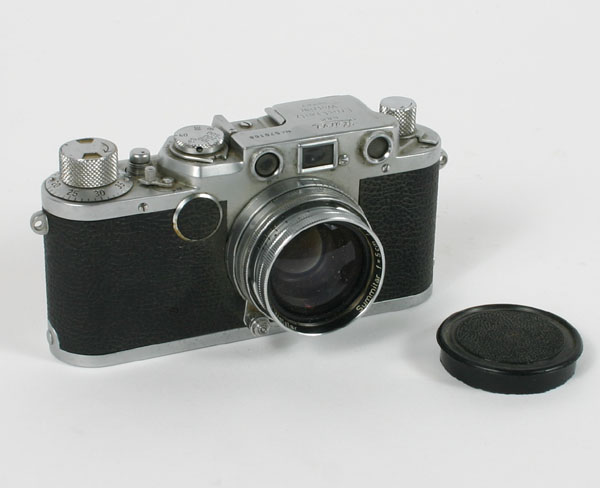 Appraisal: Leica III reflex camera black grained case and chrome frame