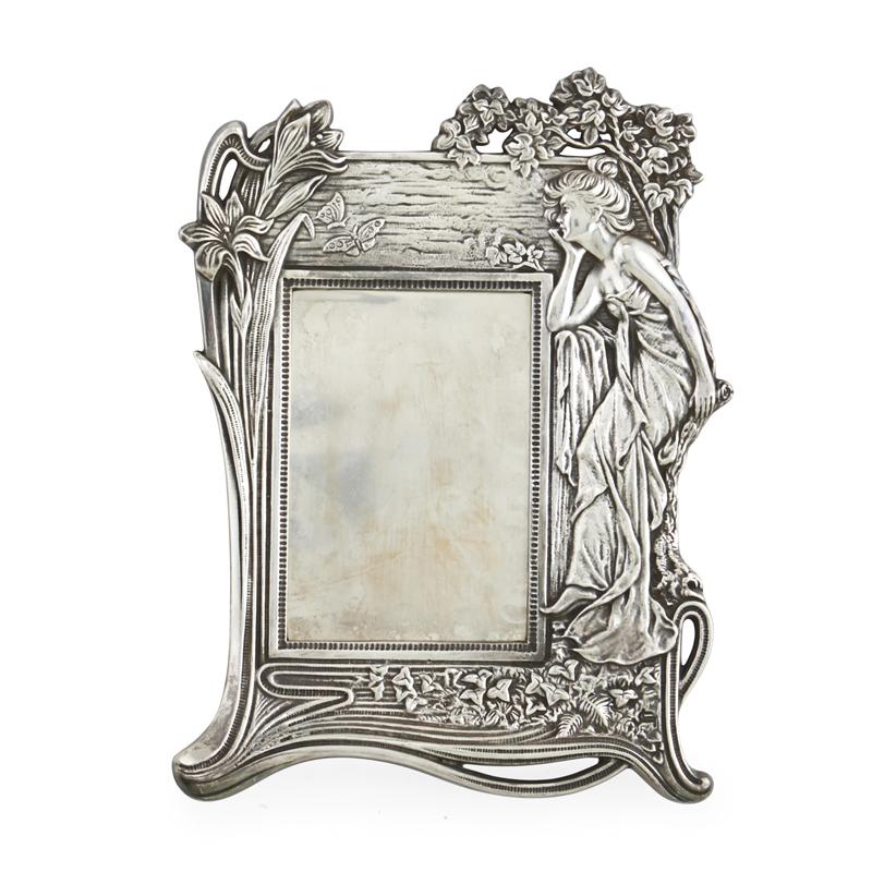 Appraisal: STERLING EASEL FRAME Art Nouveau style with a woman and