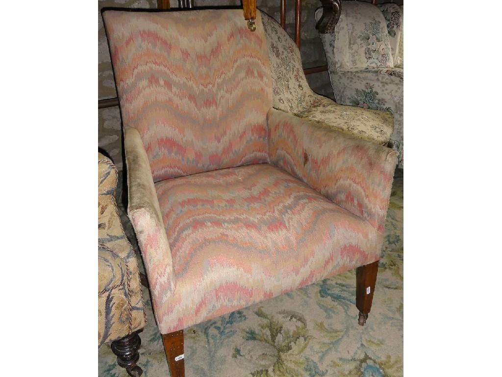 Appraisal: A wing back armchair with stylised coloured upholstery raised on