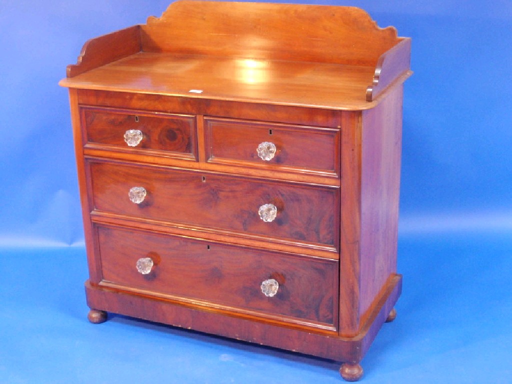 Appraisal: A Victorian mahogany tray top chest with flamed drawer fronts