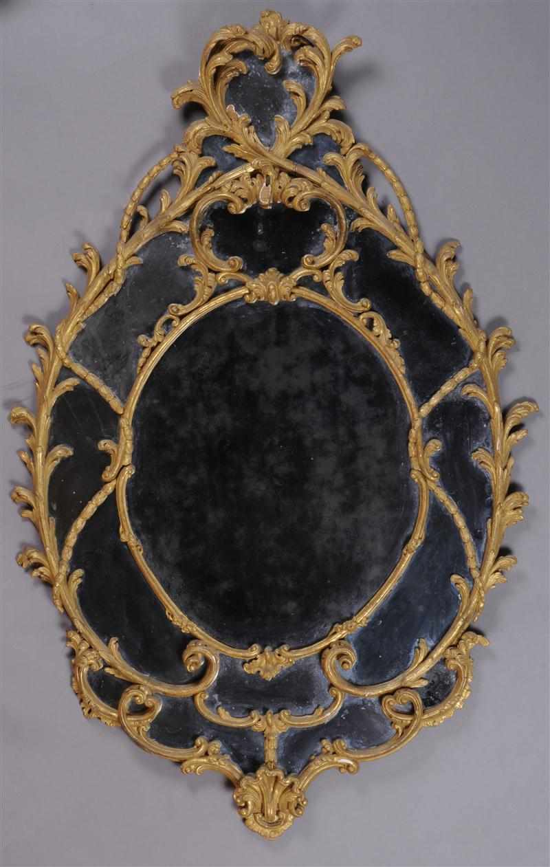 Appraisal: FINE GEORGE III CARVED GILTWOOD OVAL MIRROR With main and