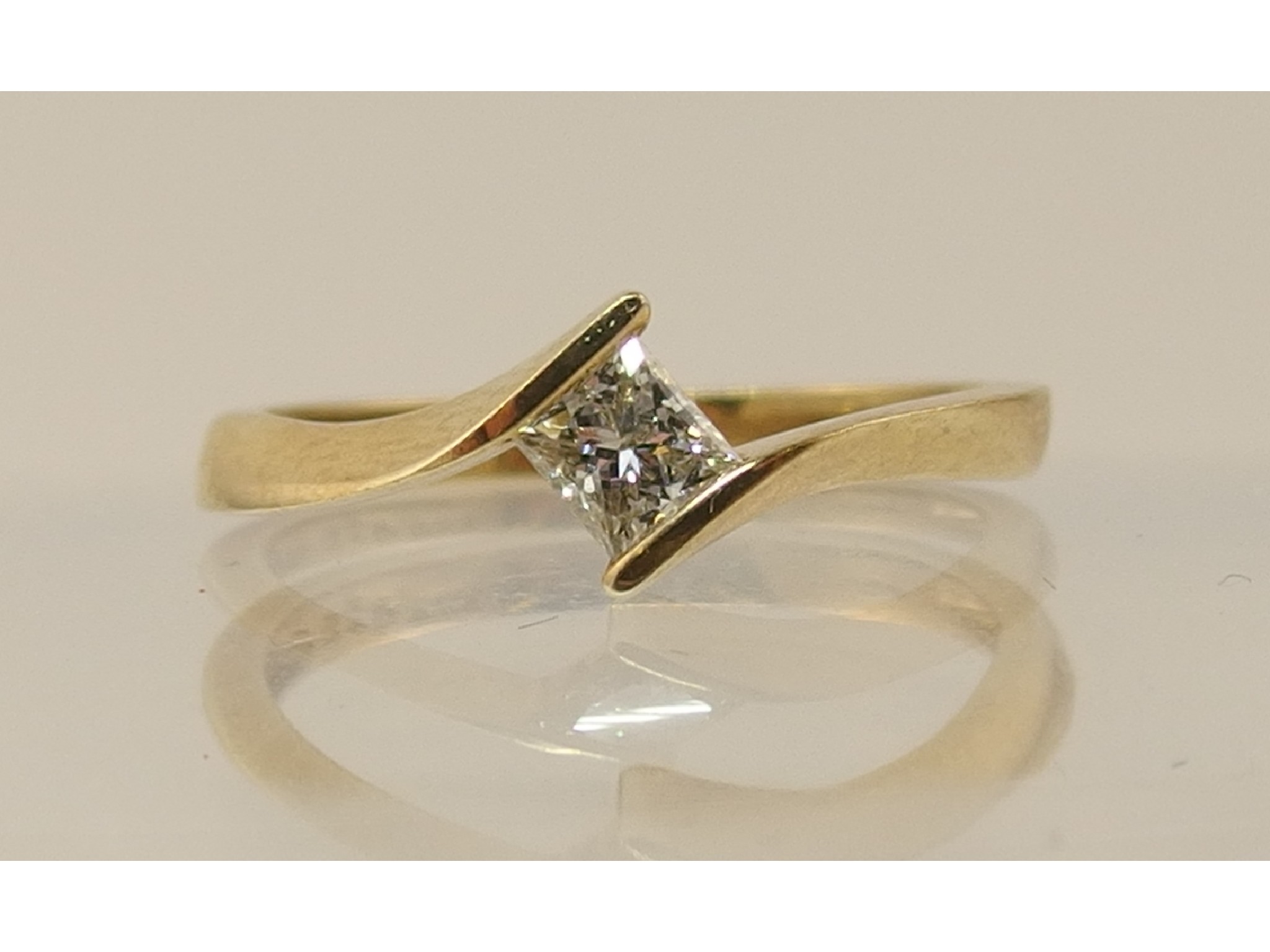 Appraisal: A ct princess cut diamond ring in a twist design